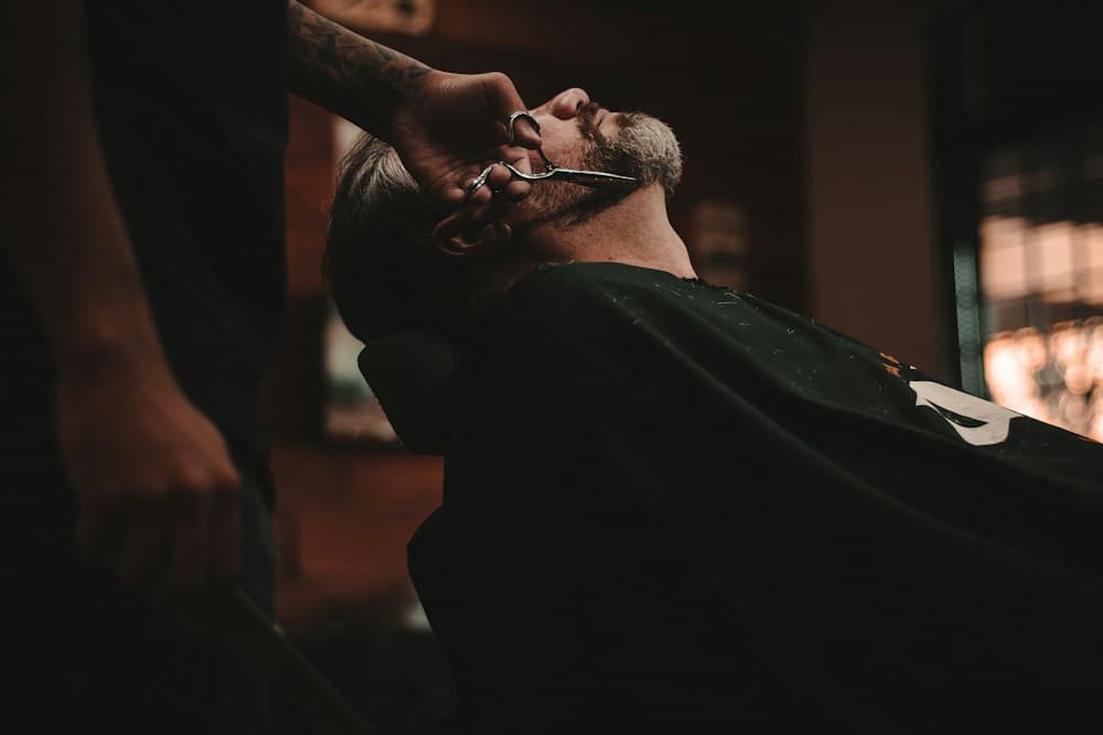 A barber serving a client